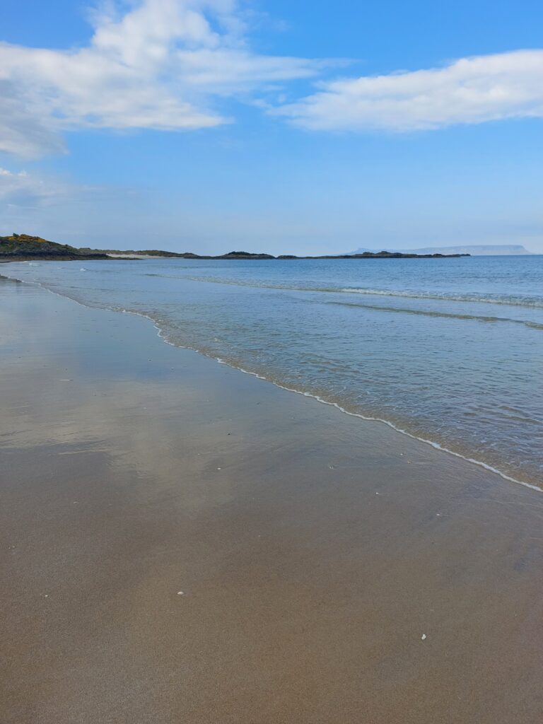 Sandy shore of Camusdarach Beach