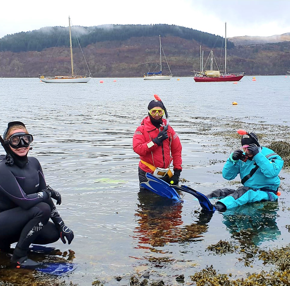 Three snorkellers (Scottish Wildlife Trust and Seawilding) in the water at Loch Craignish